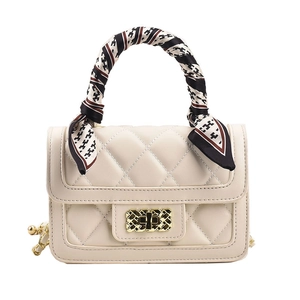 Elegant ivory quilted crossbody bag with silk scarf handle and gold hardware detail