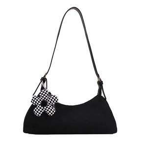 Minimalist black canvas underarm bag with checkerboard flower pendant and leather strap