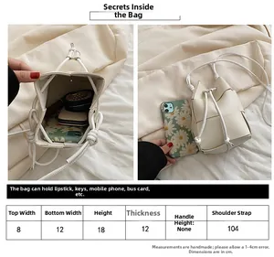 Size chart and capacity detail of cream woven crossbody bucket bag for essentials