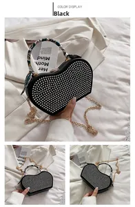 Detailed view of heart shaped black crossbody bag with silver studs and silk scarf handle