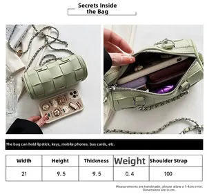 Detailed size guide for green cylinder woven bag with thick chain and strap info