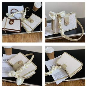 Detail of retro flap bags with embossed cartoon patterns and silk scarf chain strap