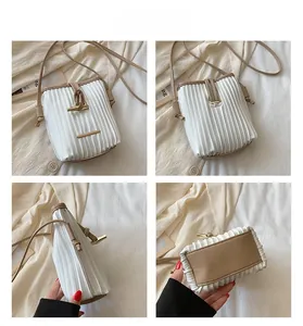 Detailed views of pleated crossbody bag featuring contrast trim and metal buckle closure