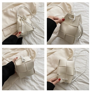 Detailed views of a beige woven bucket bag with drawstring closure and crossbody strap