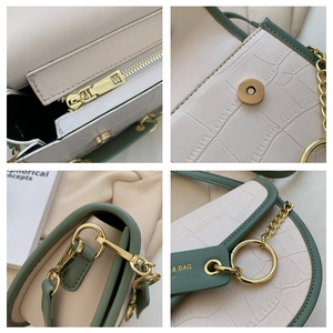 Detailed macro view of golden hardware and green crocodile texture on stylish handbag