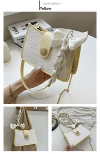 Detail of yellow flap bag with cartoon embossing, wooden buckle and silk ribbon handle