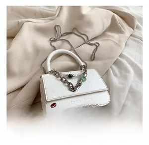 White chain crossbody bag detail with I'm like a flower print and bead decoration