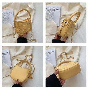 Detailed views of yellow crossbody biscuit bag with 3D embossed pattern and gold chain