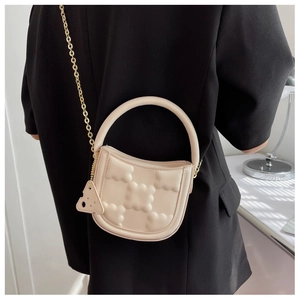 Quilted biscuit style crossbody bag in cream white with gold chain and cheese pendant
