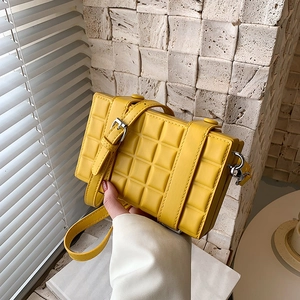 Chic bright yellow plaid crossbody box bag with textured finish and adjustable strap