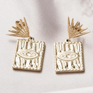 Gold rectangular Evil Eye drop earrings with radiant fan studs on purple silk