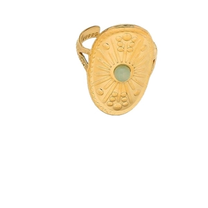 Vintage gold shield ring with sunburst texture and green gemstone center in oval design