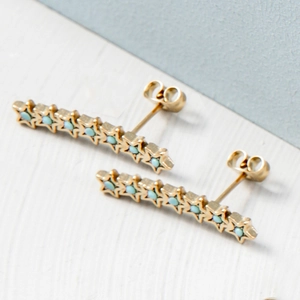 Boucles d'oreilles pendantes étoiles dorées avec perles turquoise style luxe vintage