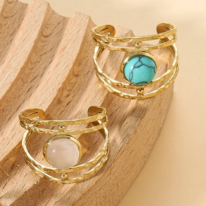 Hammered gold hollow multi-layered open ring with turquoise and pink stones in boho style