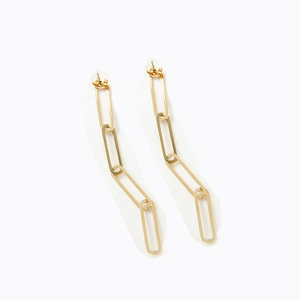 Detailed shot of polished gold paperclip link earrings with smooth metallic finish