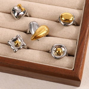 Five-piece vintage gold and silver mixed metal rings set with heart and bow motifs