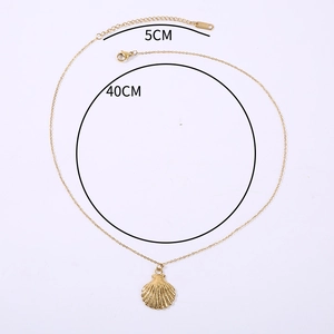 Detail of shell pendant necklace in gold finish with 40cm chain and 5cm extension