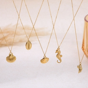 Gold stainless steel ocean theme necklace set with shell and seahorse pendants