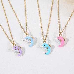 Colorful dolphin pendant necklaces in gold finish with pink blue and purple enamel charms