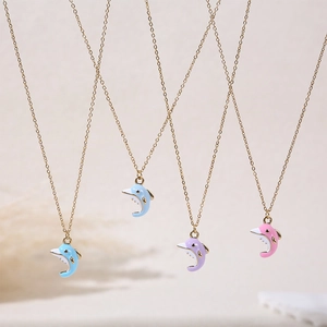 Cute candy-colored dolphin pendant necklaces with gold chain in pink, purple, and blue
