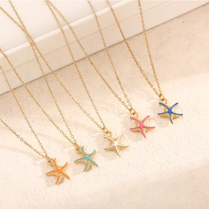 Detail of colorful starfish pendant necklaces in five colors with golden chains