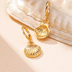 Elegant gold shell drop earrings with scalloped texture for beach summer fashion jewelry