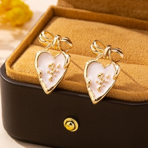 French vintage gold bow heart stud earrings with 3D rose detail on velvet jewelry box