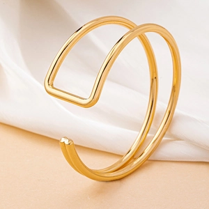 Minimalist gold double-layered open cuff bracelet with geometric square charm detail