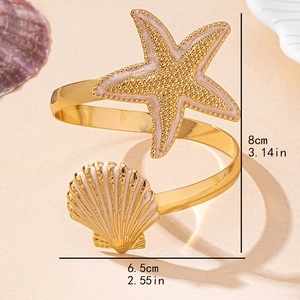 Gold starfish and shell cuff bracelet with pink enamel and adjustable open design