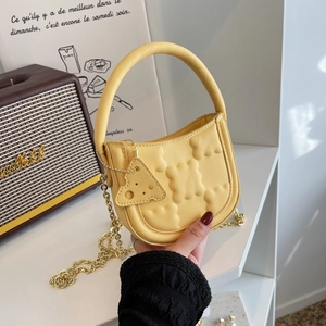 Chic yellow biscuit textured crossbody bag with cheese charm and gold chain strap
