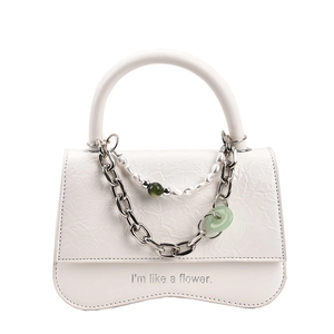 White textured handbag with chunky silver chain and pearl green bead charms