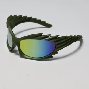 Detail view of wing-shaped matte green frames with vibrant rainbow gradient lenses