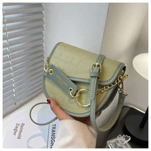 Detailed avocado green crocodile pattern saddle bag with elegant gold chain strap