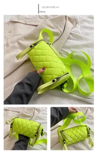 Detail of yellow quilted nylon barrel crossbody bag with dual zippers and wide strap