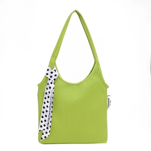 Green ribbed knit shoulder bag with polka dot ribbon and fashion label accent