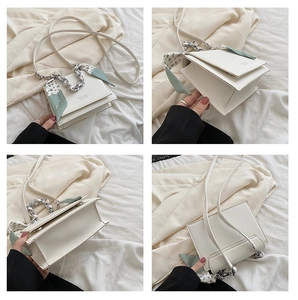 Detailed views of a white leather crossbody bag with a silk scarf and metal chain handle