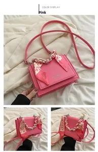 Detailed views of a pink crossbody bag with leopard silk scarf handle and metal chain strap