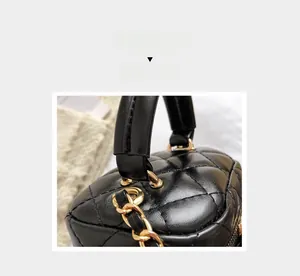 Close-up of black quilted leather mini bag with gold chain detail and textured finish
