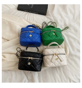 Quilted mini crossbody bags in four colors with chain straps and floral pendants