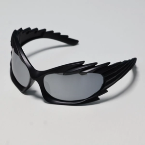 Macro detail of Y2K black wing shaped frame with silver mirrored lenses for sports