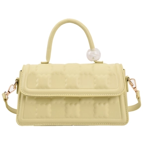 Sac à main jaune pastel en cuir matelassé avec poignée décorée d'une bille de marbre