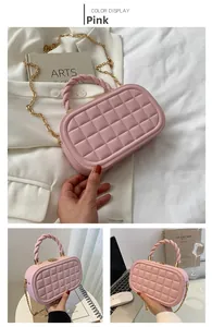 Detailed view of pink quilted box bag with golden chain and twisted handle design