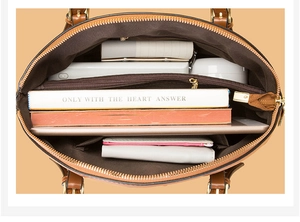Interior view of crocodile pattern bag showing large capacity with compartments and pockets