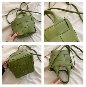 Detail of woven green bucket bag with adjustable strap and drawstring inner pouch