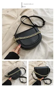 Detailed views of black saddle bag with chunky gold chain and textured faux leather