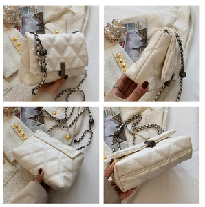 Detailed views of white quilted crossbody bag with diamond stitching and chain strap