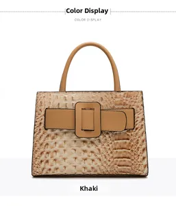 Detailed close-up of khaki tote bag featuring faux crocodile texture and metallic buckle