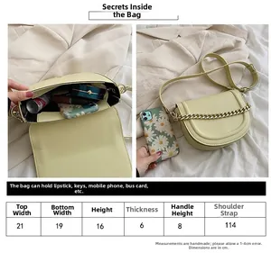 Detailed size chart and capacity display for minimalist leather saddle bag with chain
