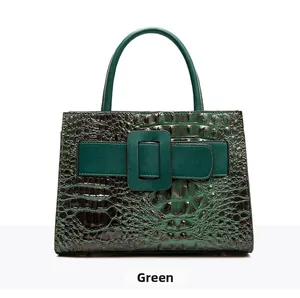 Close-up of green crocodile pattern leather texture with vintage square buckle on handbag