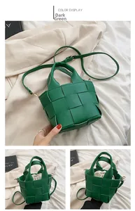 Detail of dark green woven handbag featuring checked pattern and beige drawstring inner pouch